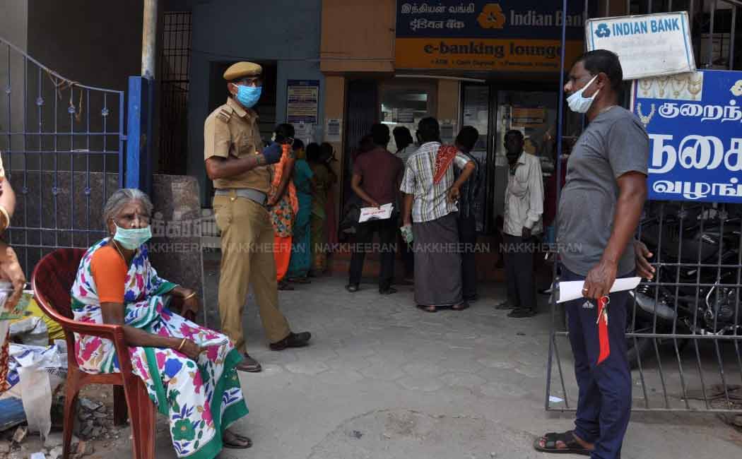 People waiting in long queues in Indian bank