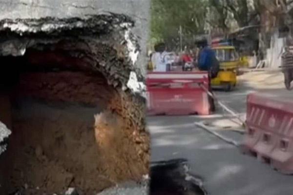 sudden pothole in the road in Korattur