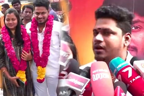 A new married couple celebrating vijay the goat