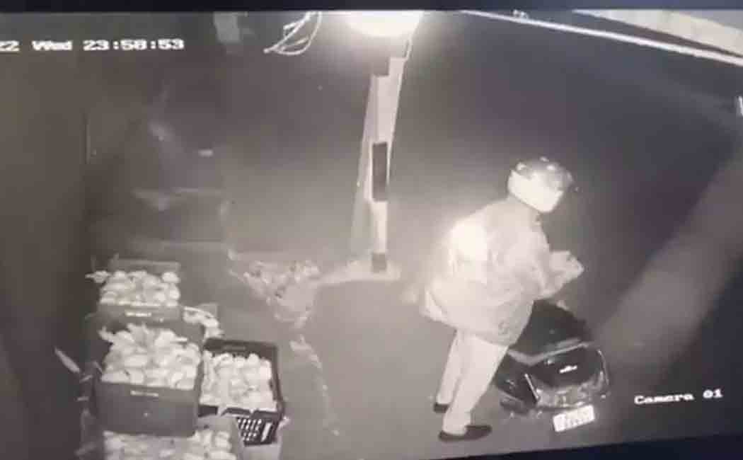 A police officer who stole mangoes was caught on CCTV