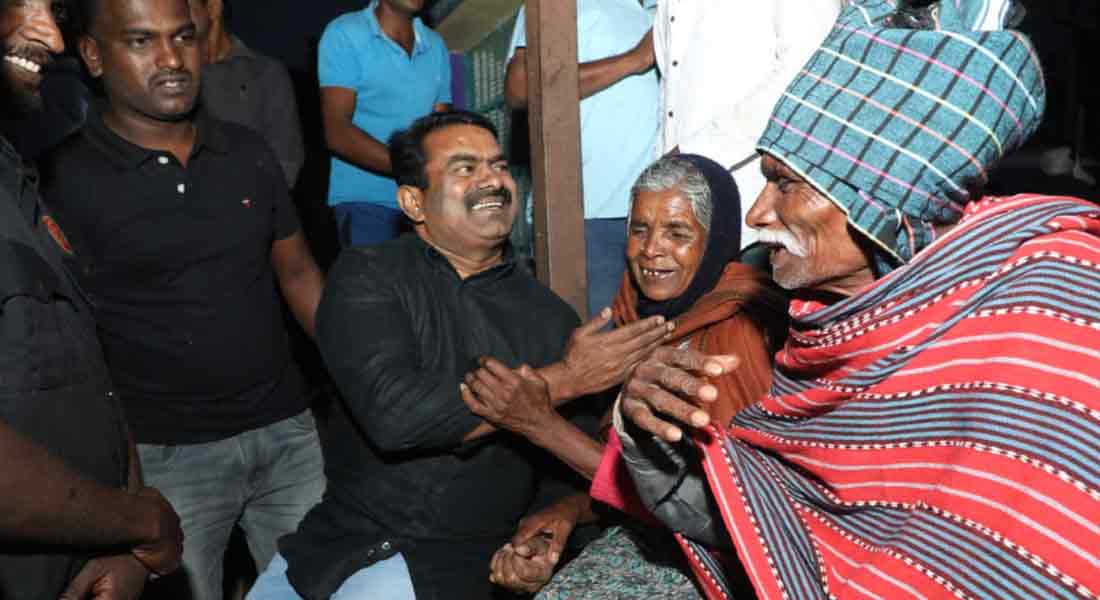 Seaman comforting Nilgiri people affected by rain