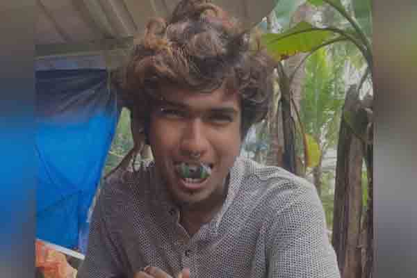 oung man with a split tongue and a tattoo