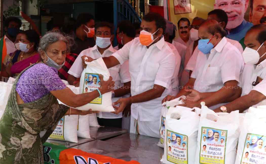 L. Murugan gives 'Modi Kit' to people