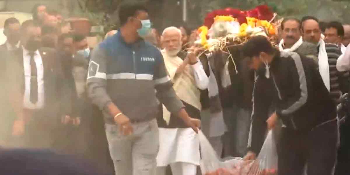 Mother's Funeral; Modi carrying the body