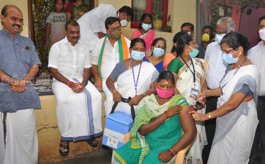 L. Murugan who went door to door campaigning to get vaccinated