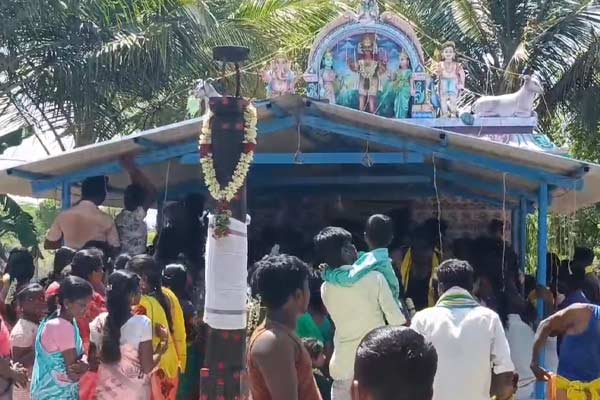 Devotees break coconuts on their heads during temple festivals