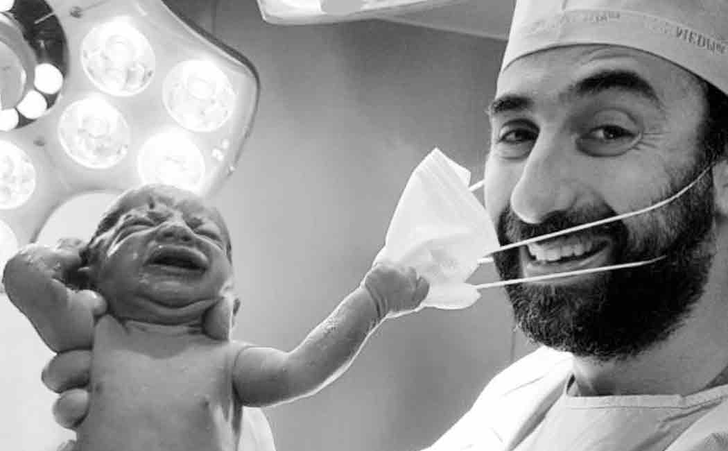 viral photo of baby removing mask
