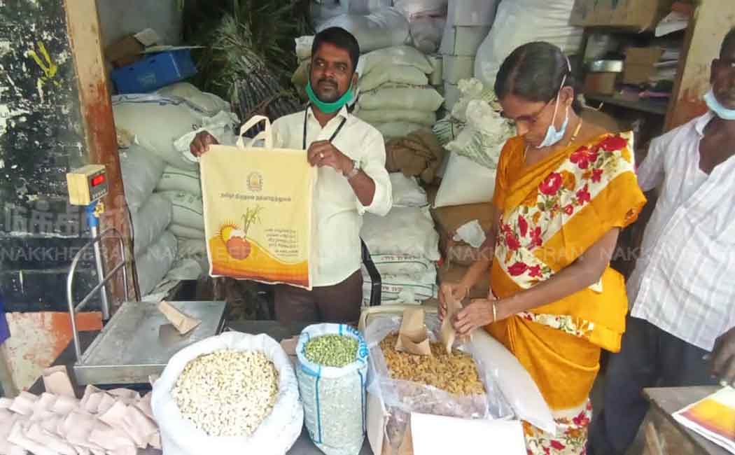 Staff distributing tokens for Pongal gifts