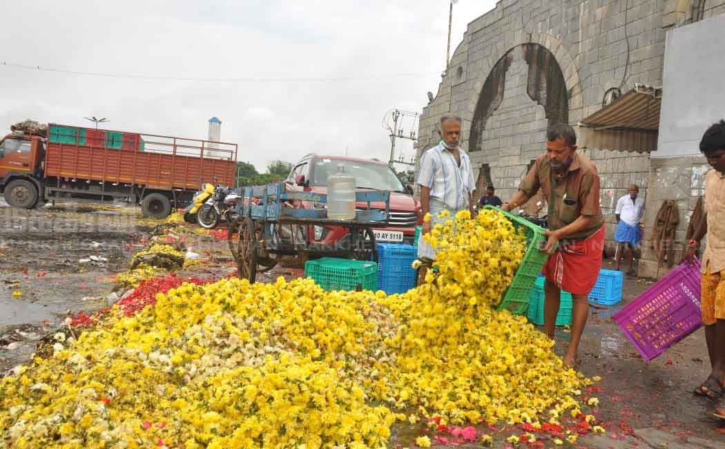 Flowers Traders dumping in the trash