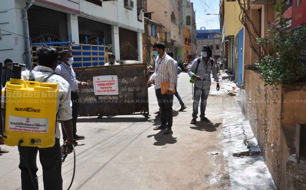 Corporation employees in the process of setting up a barrier