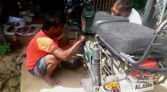 confident motorcycle mechanic Srinivasan ... !!