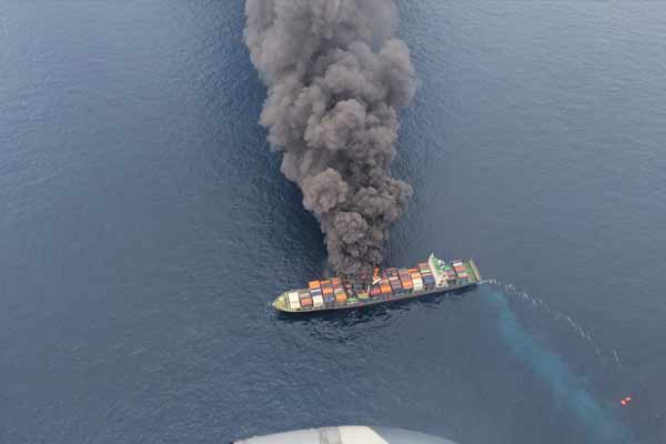A ship on fire in the middle of the ocean kerala