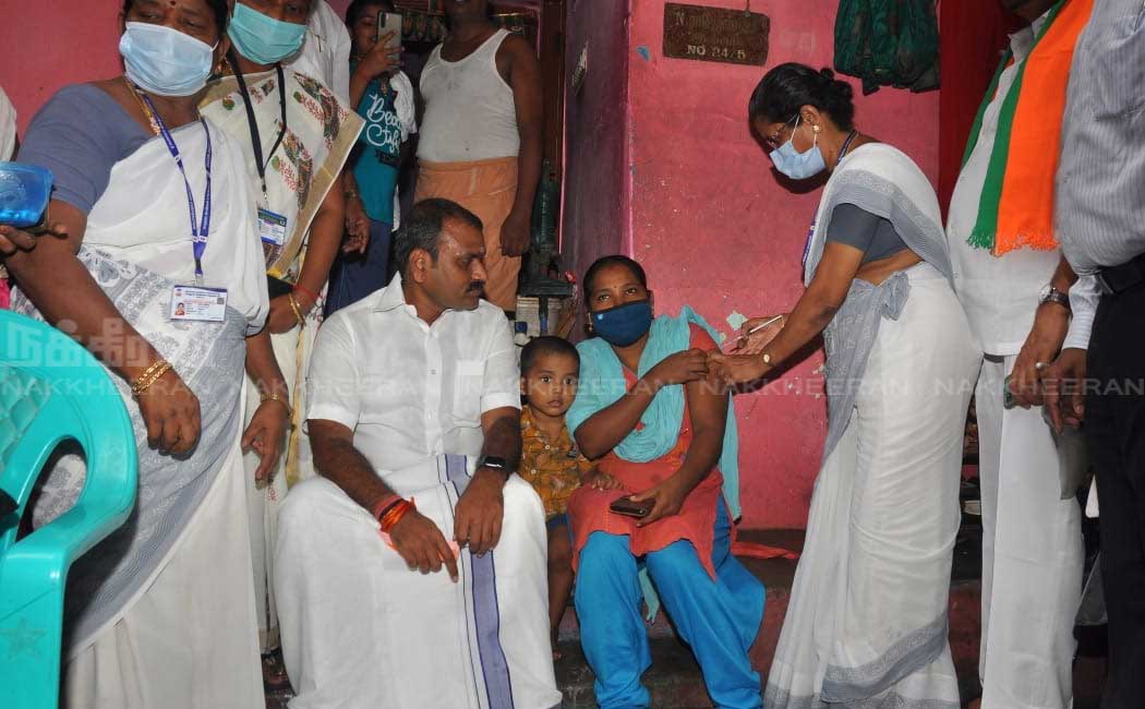 L. Murugan who went door to door campaigning to get vaccinated