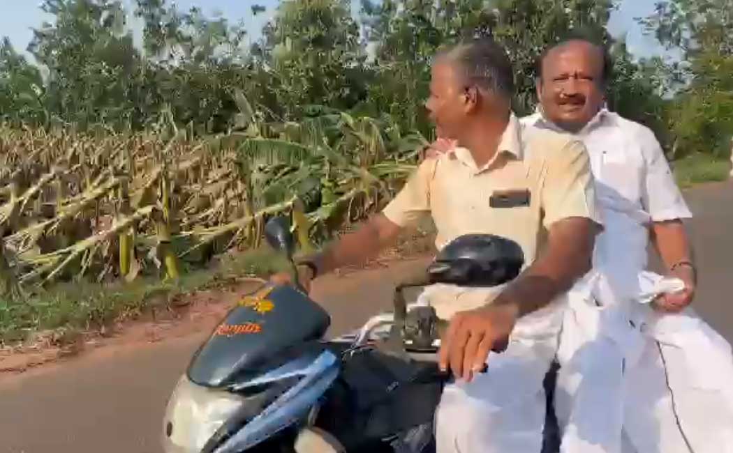 minister went on a two-wheeler and inspected the banana trees that had fallen due to the typhoon
